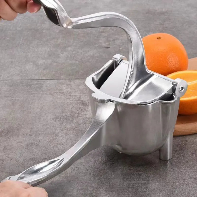 Manual household juicer in use